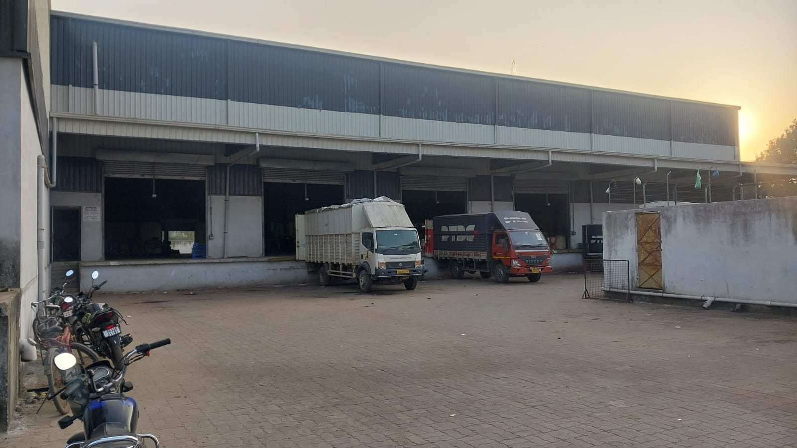Multi-bay loading dock with trucks